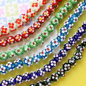 Close-up of handmade millefiori glass flower beads for DIY jewelry and necklaces