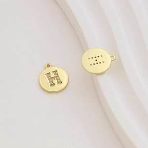 Detailed view of gold-plated letter H pendant with micro-inlaid cubic zirconia for DIY jewelry