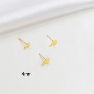 Detailed macro view of 4mm gold-plated flat base ear studs with hanging loop