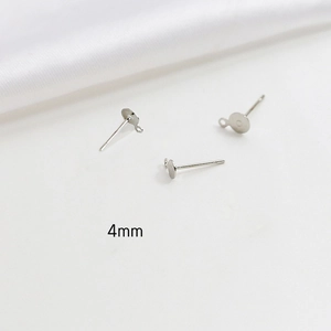 Detail view of 4mm silver-plated earring studs with loops for DIY jewelry making