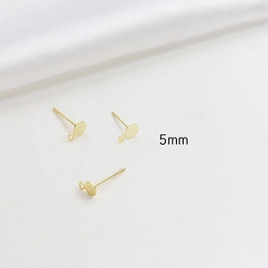 Close-up of 5mm gold plated flat stud earrings with hanging loop for DIY jewelry making
