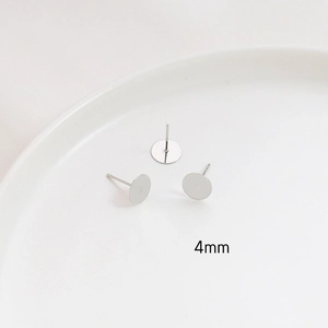 Macro shot of 4mm silver plated stud earring bases with S925 needles for DIY jewelry