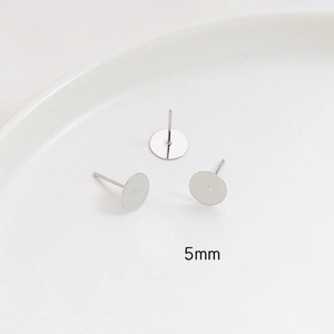 Detailed macro view of 5mm S925 silver flat round ear studs for DIY jewelry making