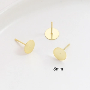 Macro detail of 8mm gold-plated flat base ear stud components with S925 silver needles