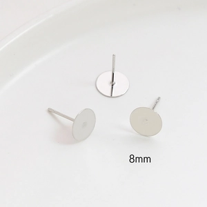 Macro view of 8mm silver metal flat base earring posts for DIY jewelry making