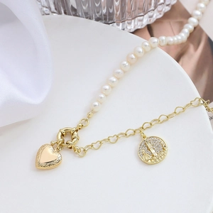 Locket necklace with pearls, heart-shaped chain and vintage castle relief pendant