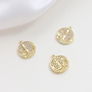 Macro shot of gold-plated castle pendants with micro-pave cubic zirconia inlay detail