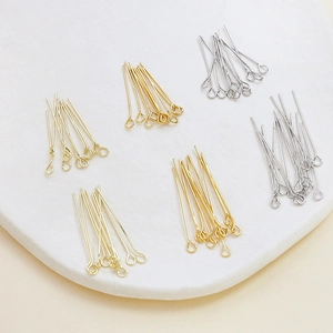 Detail of 14k gold-plated and silver eye pins for DIY jewelry making and beading