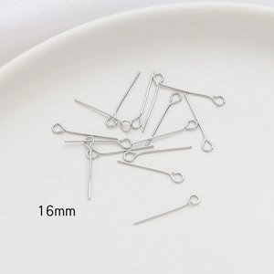 Macro view of 16mm silver 14k gold-filled eye pins for DIY jewelry making and crafts