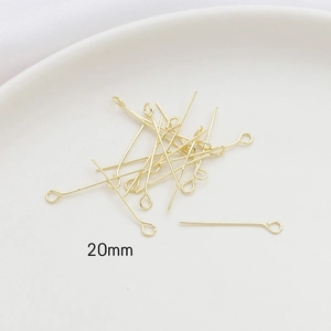 Macro detail of 20mm 14k gold-plated 9-shape headpins for DIY jewelry making