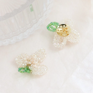 Macro shot of handmade beaded glass flower accessories with intricate wire craftsmanship