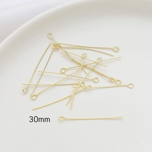 Macro view of 30mm 14k gold plated eye pins for DIY jewelry making and accessories
