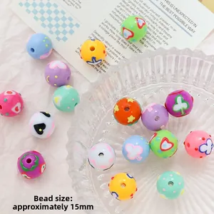 Detail of 15mm colorful acrylic beads with mixed cartoon prints for DIY jewelry making