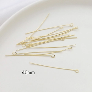 Macro view of 40mm 14k gold plated eye pins for DIY jewelry making and beading
