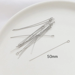 Detailed view of 50mm silver eye pins for DIY jewelry making and beaded crafts