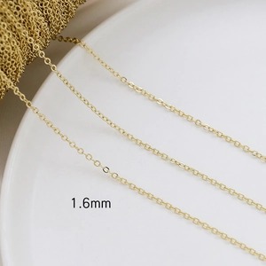 Detail showing 1.6mm gold-plated O-chain link for DIY jewelry making on white tray