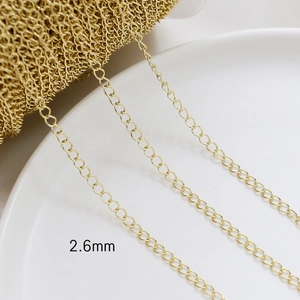 Macro detail of 2.6mm gold plated cross chain for DIY jewelry necklace making