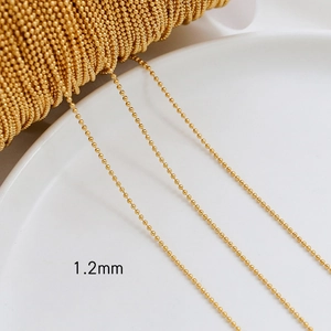 Detailed macro view of 1.2mm gold plated ball chain for DIY jewelry making and crafts