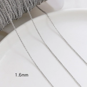 Macro shot of 1.6mm silver cross chain links for DIY handmade jewelry crafting