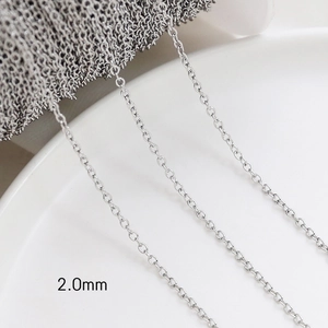 Macro detail of 2.0mm wide silver-plated cross chain spool for DIY jewelry making