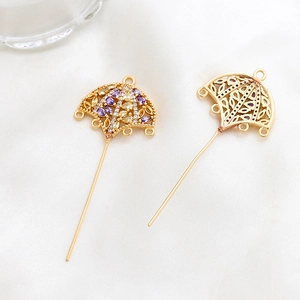 Detail of umbrella jewelry connector with colorful zircon stones and DIY hanging loops