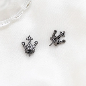Detailed close-up of S925 sterling silver crown earrings with cubic zirconia inlay