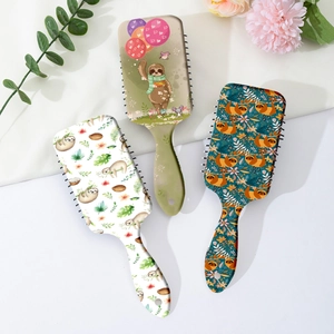 Three cute cartoon sloth print massage hairbrushes with heart-shaped hanging holes