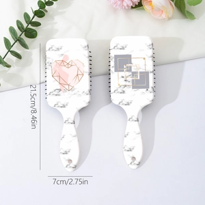 Marble pattern air cushion hairbrush with geometric gold heart and square designs