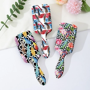 Artistic feather print air cushion hairbrush set with vibrant graffiti style designs