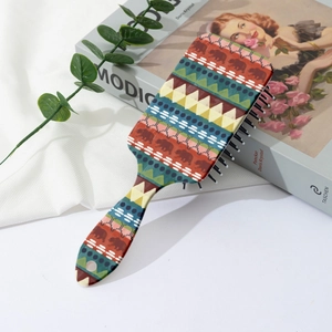 Detail of bohemian air cushion hairbrush with ethnic patterns and soft massage bristles