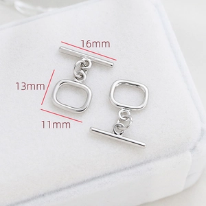 Gros plan du fermoir à bascule argenté avec barre de 16mm pour la création de bijoux