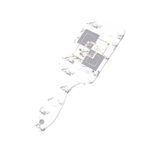 Modern marble pattern paddle brush with ergonomic handle and gold accents on white background