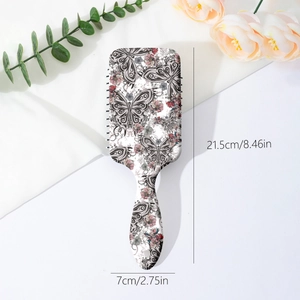 Vintage butterfly hairbrush with cushioned massage bristles measuring 21.5cm by 7cm