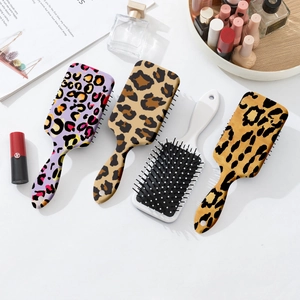 Set of four large leopard print hair brushes with air cushions for scalp massage
