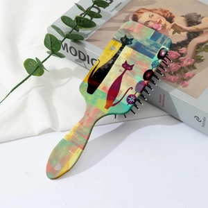 Artistic air cushion hairbrush with colorful abstract cat print and hanging hole detail