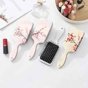 Scalp massage hair brush set with elegant plum blossom floral prints and ergonomic handle