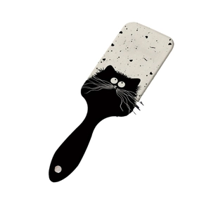 Cute white air cushion hair brush with black cartoon cat illustration and ergonomic handle