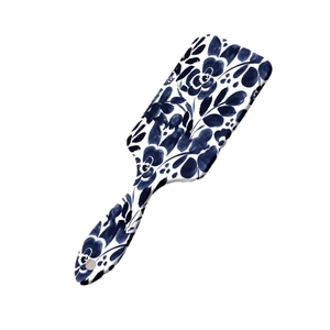 Floral print paddle brush with blue flower pattern and cushioned air massage bristles