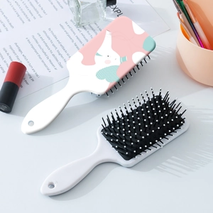 Cute cartoon bear and elephant hair brush set with air cushion massage bristles on white table