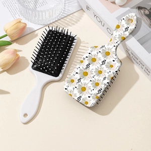 Floral hair brush with daisy and music note patterns for scalp massage and detangling