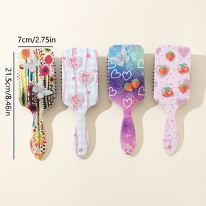 Colorful floral and strawberry print detangling hairbrushes in four vibrant styles