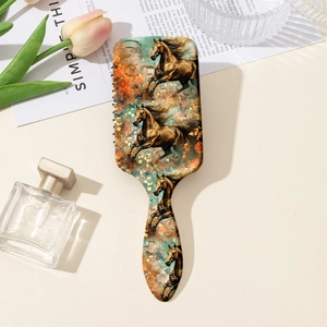 Artistic paddle brush with horse print displayed on a vanity table with tulips