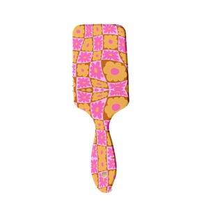 Floral checkerboard rectangle air cushion hairbrush with ergonomic handle on white background