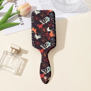 Détails de la brosse à cheveux vintage avec imprimé papillon et coussin d'air