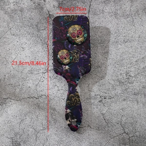 Gothic skull and tropical pattern air cushion hairbrush with dimensions 21.5x7cm