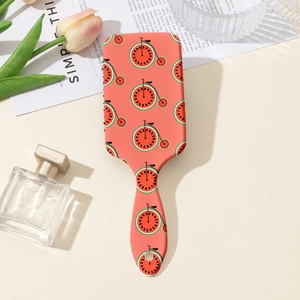 Détail de la brosse à coussin d'air rectangulaire avec motif pastèque et fini rose corail