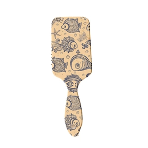 Rectangular air cushion hairbrush with beige base and vintage navy blue fish pattern
