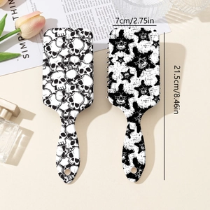 Star and skull print massage hairbrush set with dimensions 21.5cm by 7cm