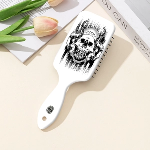 Aztec skull print air cushion hairbrush with floral pattern on a lifestyle background