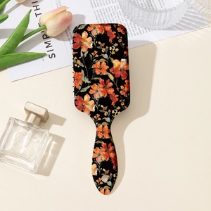 Vintage floral print cushion hairbrush for detangling long hair in a stylish setup